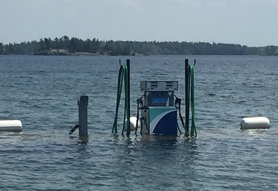 Gas Pump On The Dock Of Ed Huck Marine Partially Underwater